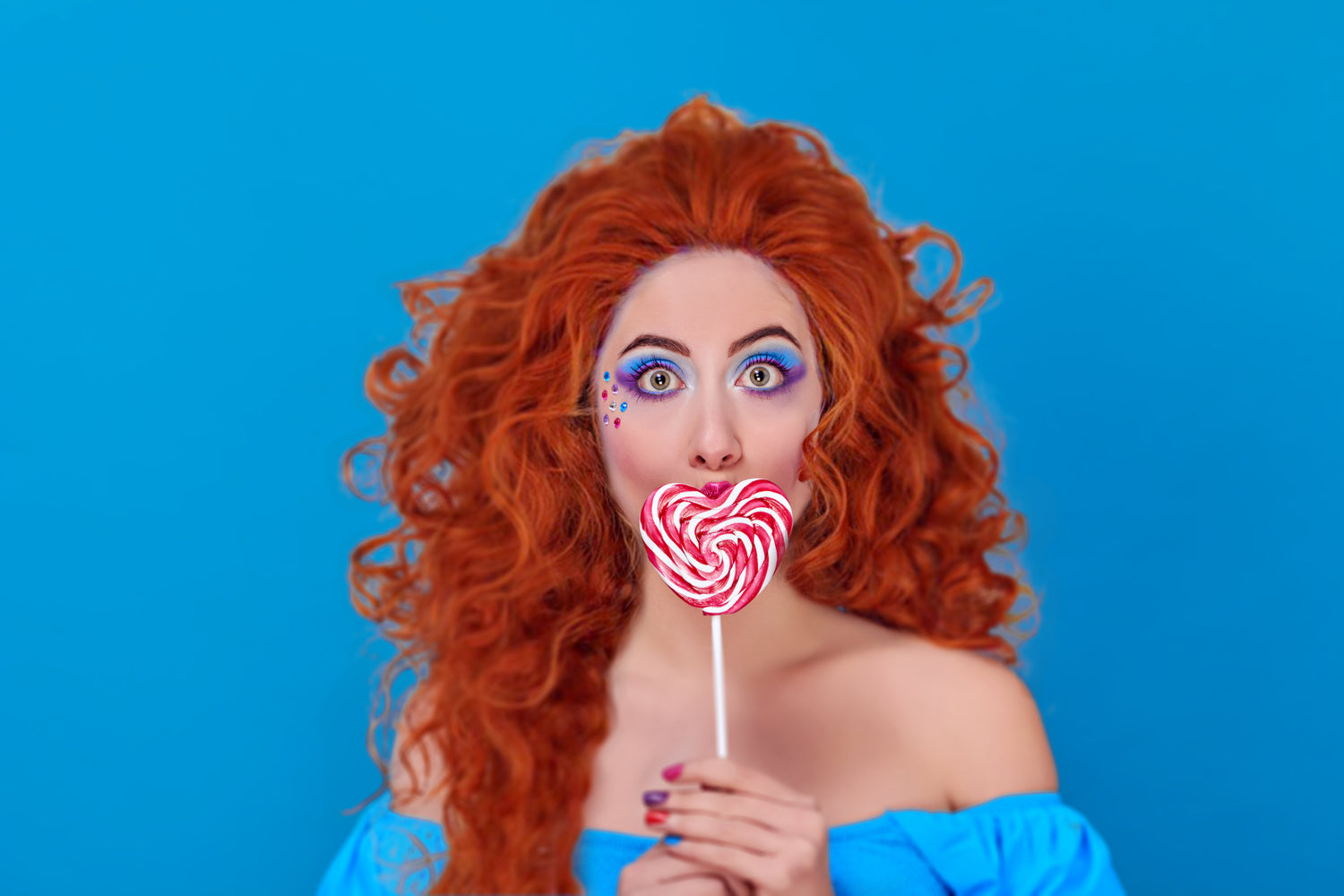 woman with heart shaped lolipop with bright red curly hair wig 
